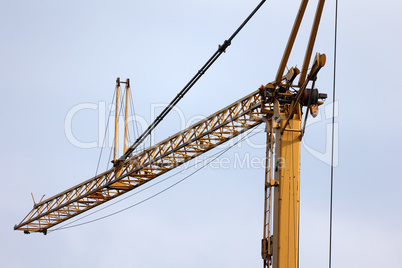 Boom of a construction crane on a blue sky background