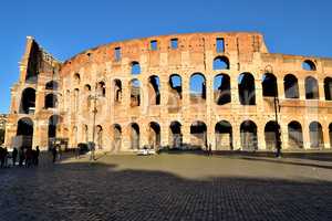 Rome, Italy - December 13th 2020: View of the Coliseum with few tourists due to the Covid19 epidemic