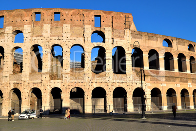 Rome, Italy - December 13th 2020: View of the Coliseum with few tourists due to the Covid19 epidemic