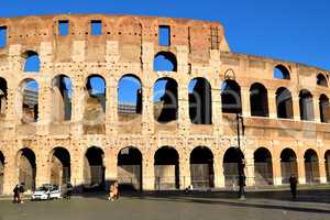 Rome, Italy - December 13th 2020: View of the Coliseum with few tourists due to the Covid19 epidemic