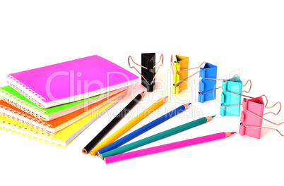 Colorful notepads clip for paper and pencils on a white backgrou