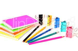 Colorful notepads clip for paper and pencils on a white backgrou