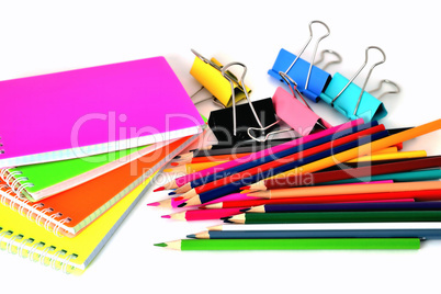 Colorful notepads clip for paper and pencils on a white backgrou