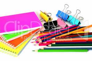 Colorful notepads clip for paper and pencils on a white backgrou