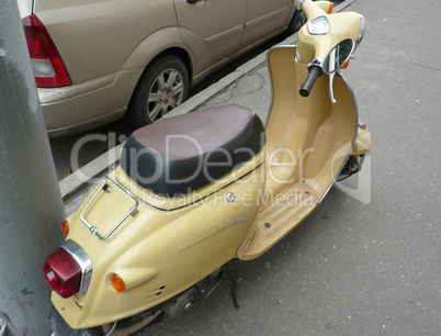 motor-scooter on pavement at day