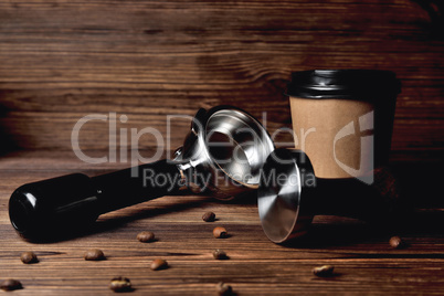 temper portafilter coffee beans cardboard coffee cup on a brown
