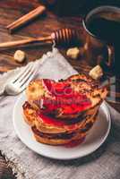 Stack of french toasts with berry marmalade
