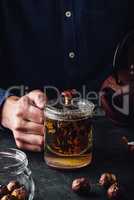 Steeping red tea in glass mug