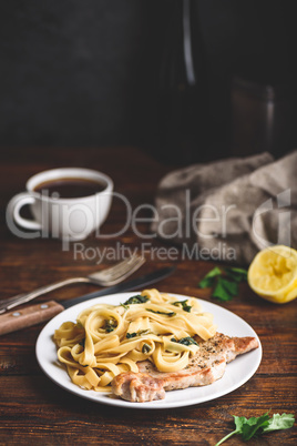 Pork chop steak with tagliatelle and capers