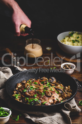 Fried pork neck steak with different mushrooms