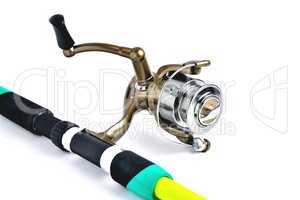 fishing reel on a fishing rod, white background close-up, copy s
