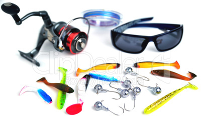 different accessories for fishing, glasses, silicone bait, reel,