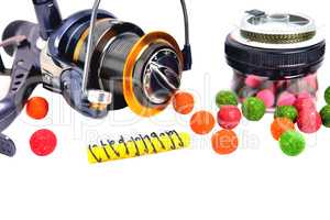 Fishing coil, colored boilies, braided cord, on white background