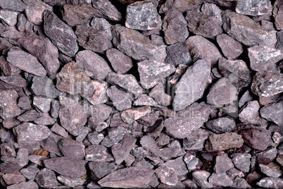 small non-uniform stones burgundy-gray color, background