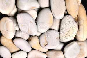 gray rounded stones of heterogeneous structure, background