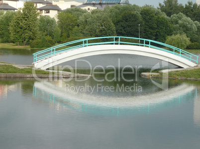 bridge over pond in city park