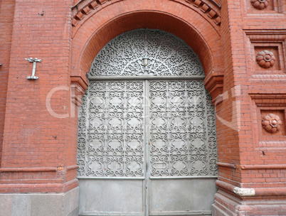 old red brick building with sectile gate
