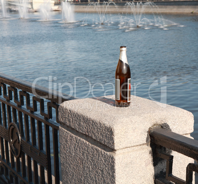 bottle on fence