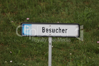 Parking place for visitors. Inscription in German - Visitors