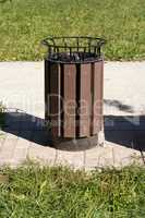 Dustbin in Park at dry sunny summer day