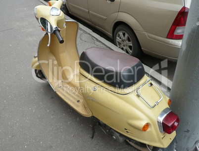 motor-scooter on pavement at day