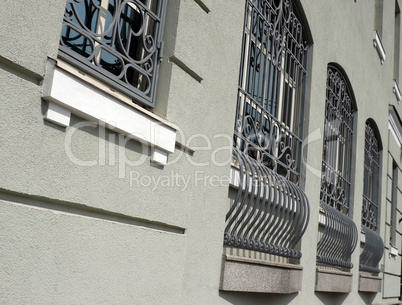 windows of building with grid at day