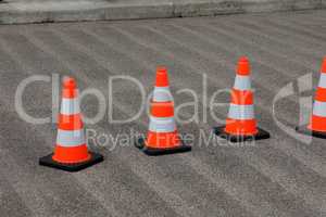 Traffic cones on the street secure the work