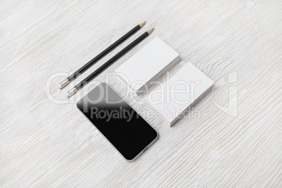 Smartphone, business cards, pencils