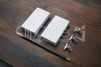 Business cards, pencil, paper clips