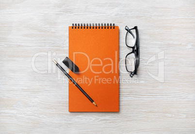 Notebook, glasses, pencil, eraser