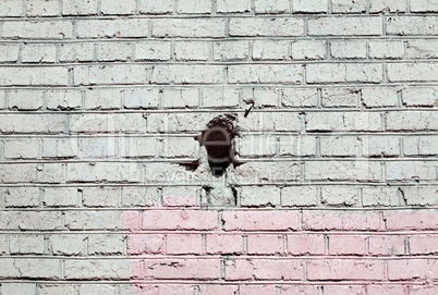 red brick wall background  with black hole