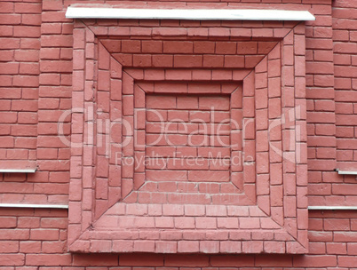 red brick wall with window shape