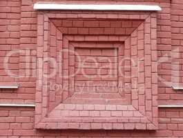 red brick wall with window shape