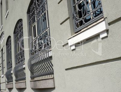 windows of building with grid at day