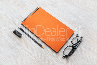 Notepad, glasses, pencil, eraser