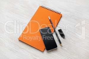 Notepad, smartphone, pencil, eraser