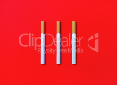 Three cigarettes on red