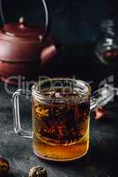Steeping red tea in glass mug