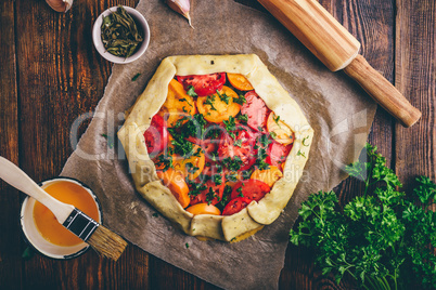 Uncooked tomato galette on baking paper