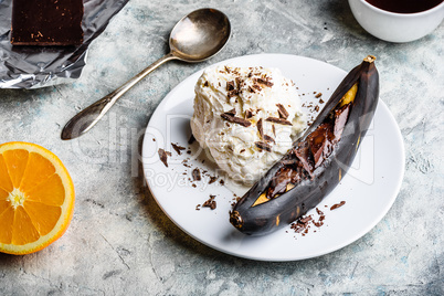 Grilled banana with dark chocolate and vanilla ice cream.