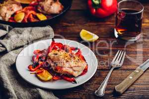 Baked chicken thighs with red bell peppers and lemon