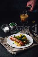 Baked pork sausage with green bell peppers, onion and herbs
