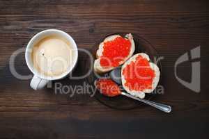 Red caviar, coffee cup