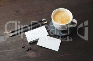 Business cards, pencils, coffee cup