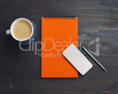 Smartphone, notepad, coffee, pen