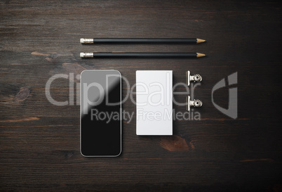 Smartphone, business card, pencils