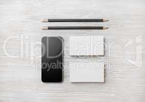 Smartphone, business cards, pencils