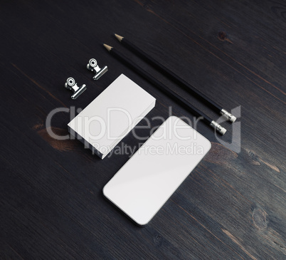 Smartphone, business cards, pencils