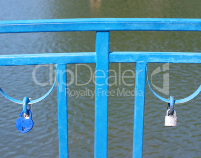 railing over pond at dry sunny summer day