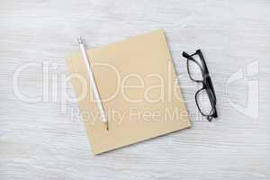 Sketchbook, pencil, glasses